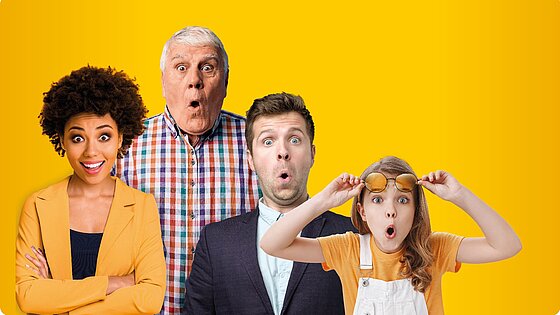Four people of different genders and ages stand in front of a yellow background and look surprised